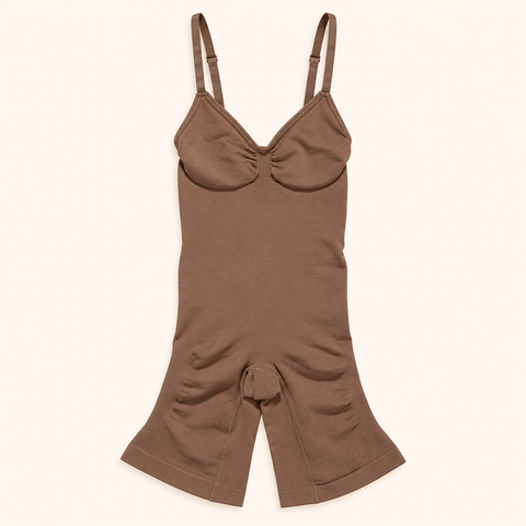 Brown seamless body shaper with adjustable straps on a cream background