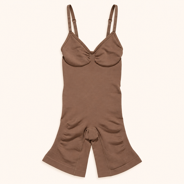 Brown seamless body shaper with adjustable straps on a cream background